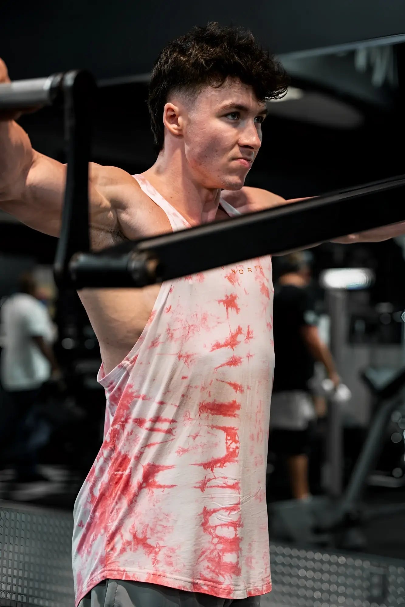 Classic bodybuilding racerback stringer tank top in white and red tie dye with a loose athletic fit
