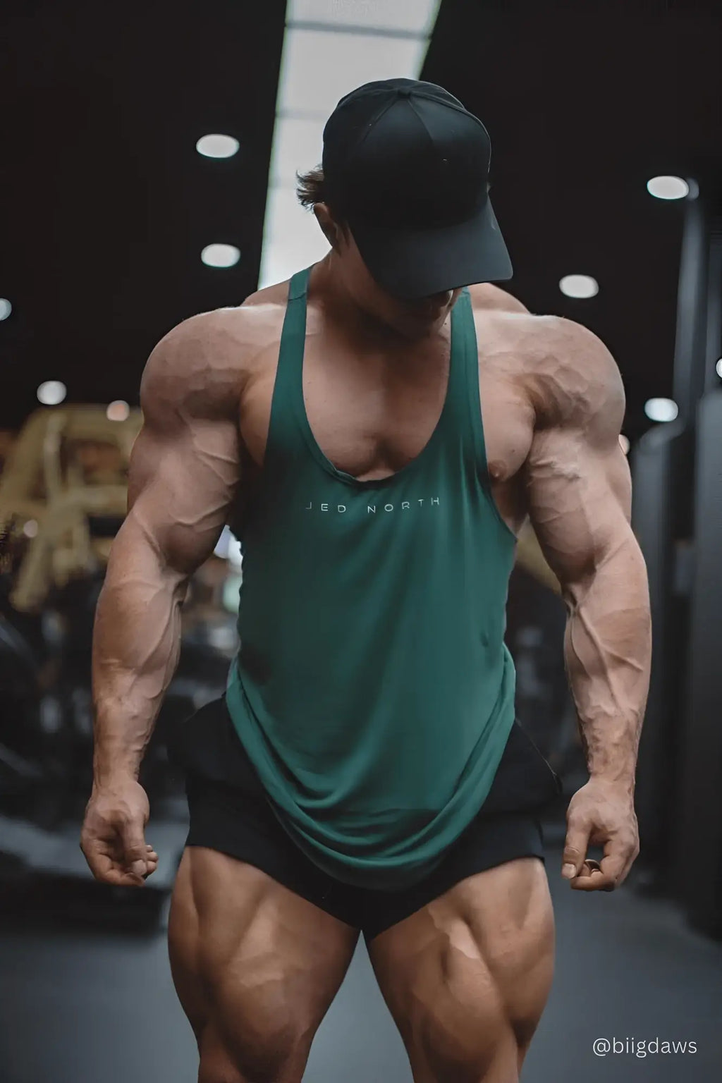 Dark green sleeveless athletic tank top with jed north white logo across chest classic bodybuilding racerback stringer sea green