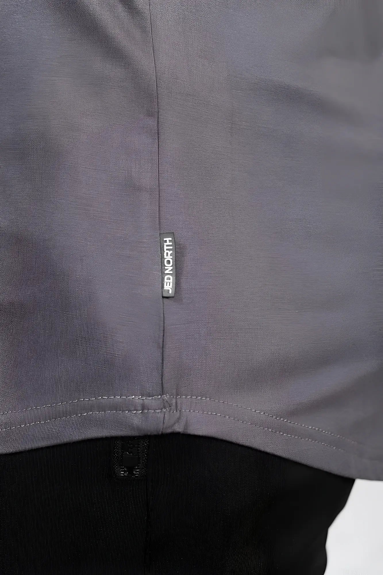 Dark gray soft cotton jed north classic bodybuilding racerback stringer with vertical seam and brand tag near hem