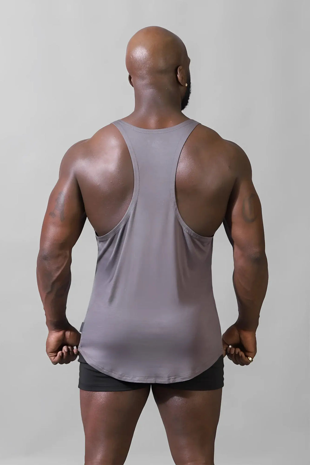 Gray muscle tank top with racerback design made of breathable fabric for bodybuilding by Jed North steel gray