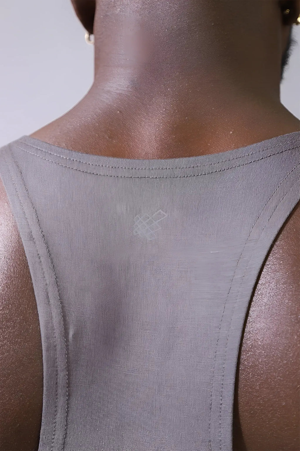 Back view of jed north classic bodybuilding racerback stringer in steel gray with ribbed fabric and subtle logo