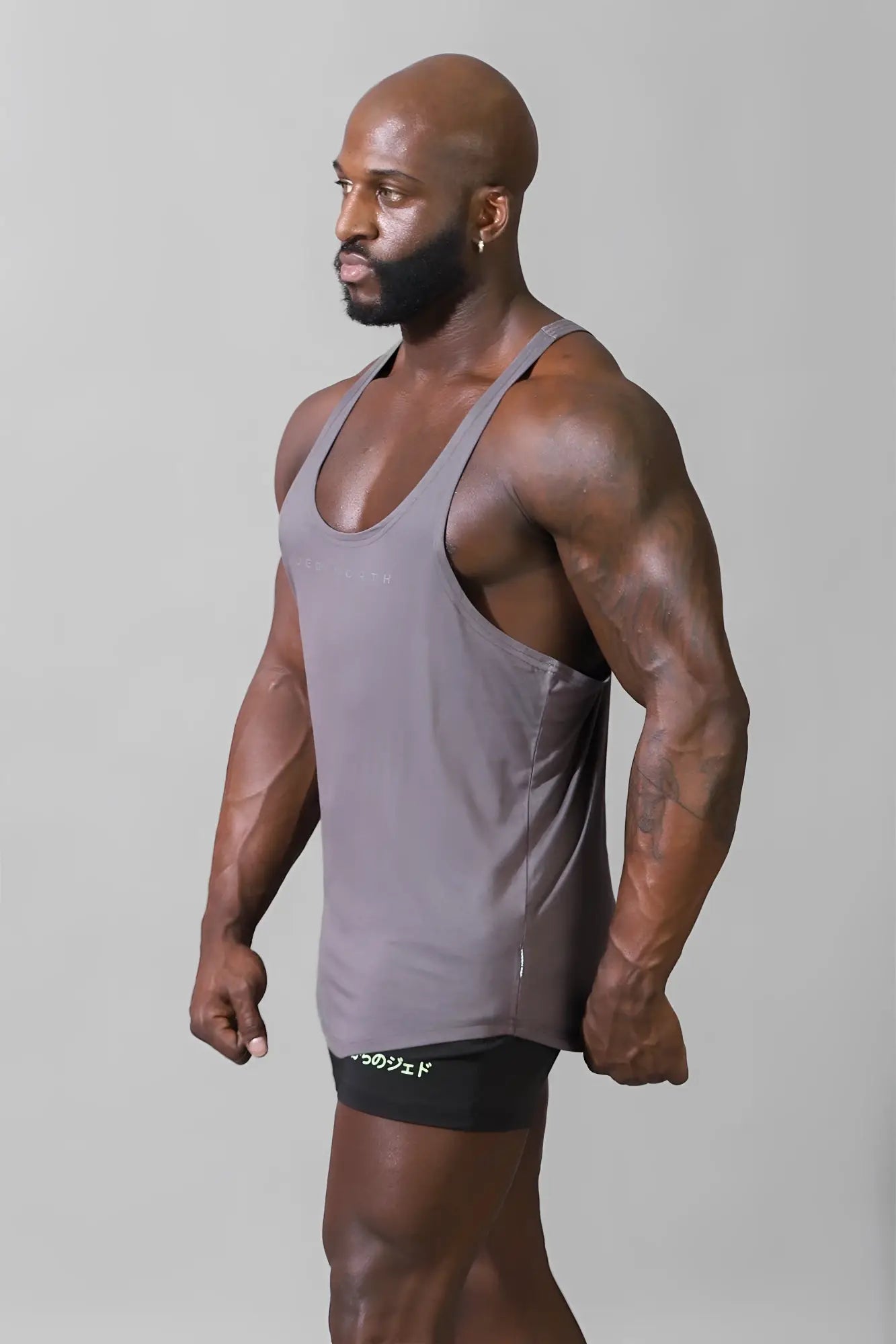 A sleek steel gray Jed North classic bodybuilding racerback stringer tank top with subtle side seam detailing