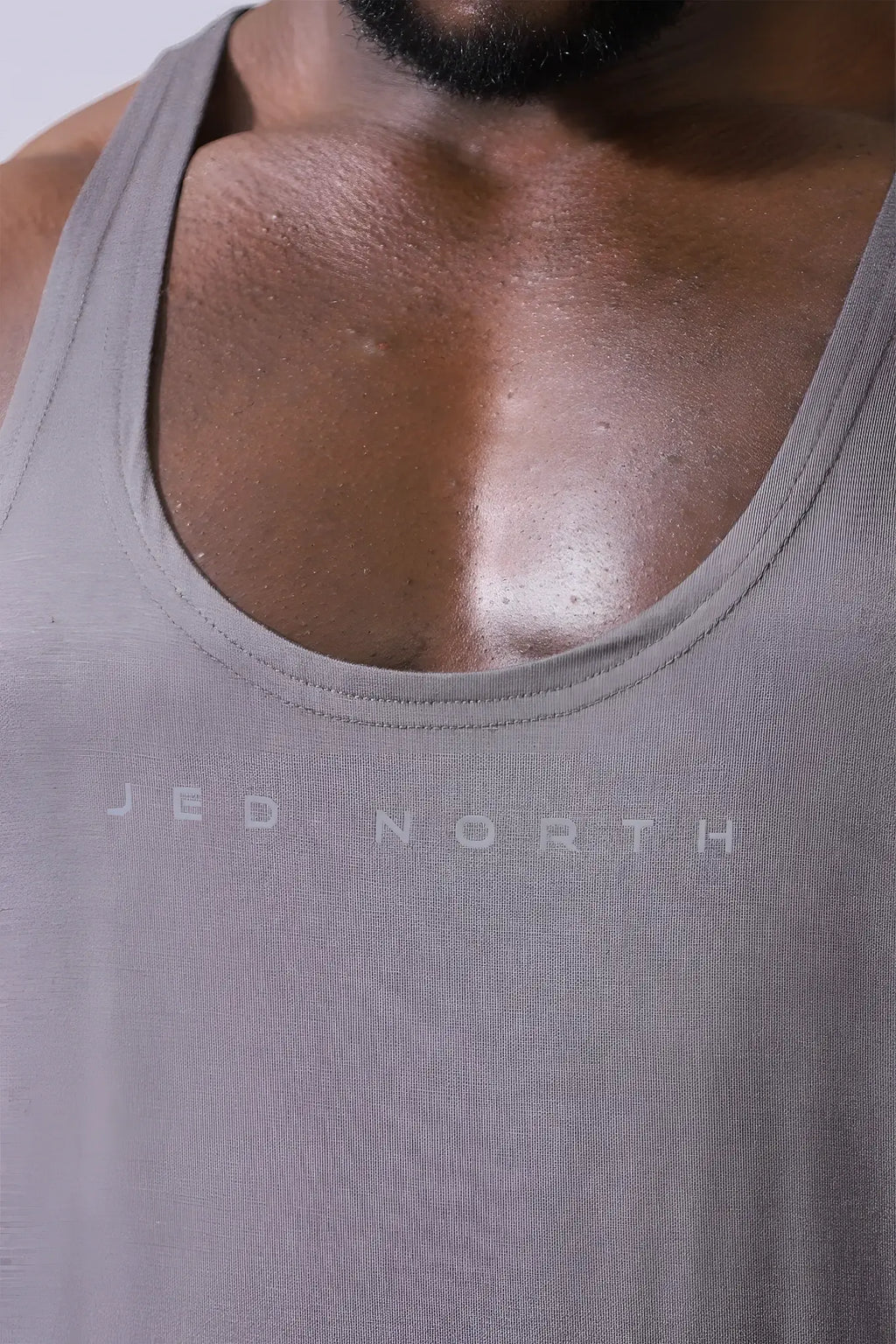 Gray textured Jed North classic bodybuilding racerback stringer tank top in steel gray with subtle chest print