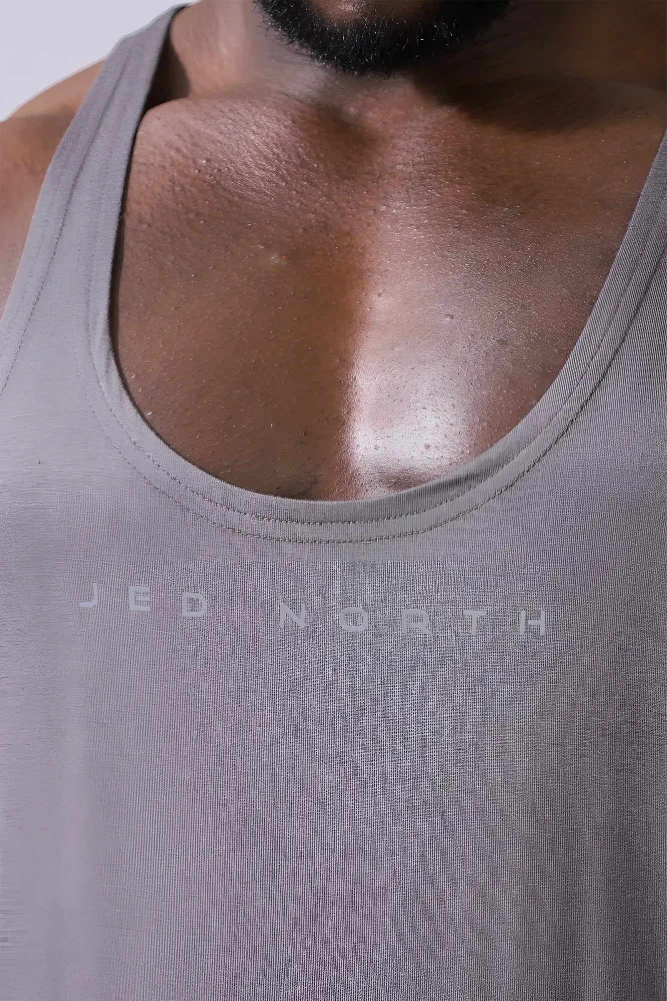 Gray textured Jed North classic bodybuilding racerback stringer tank top in steel gray with subtle chest print