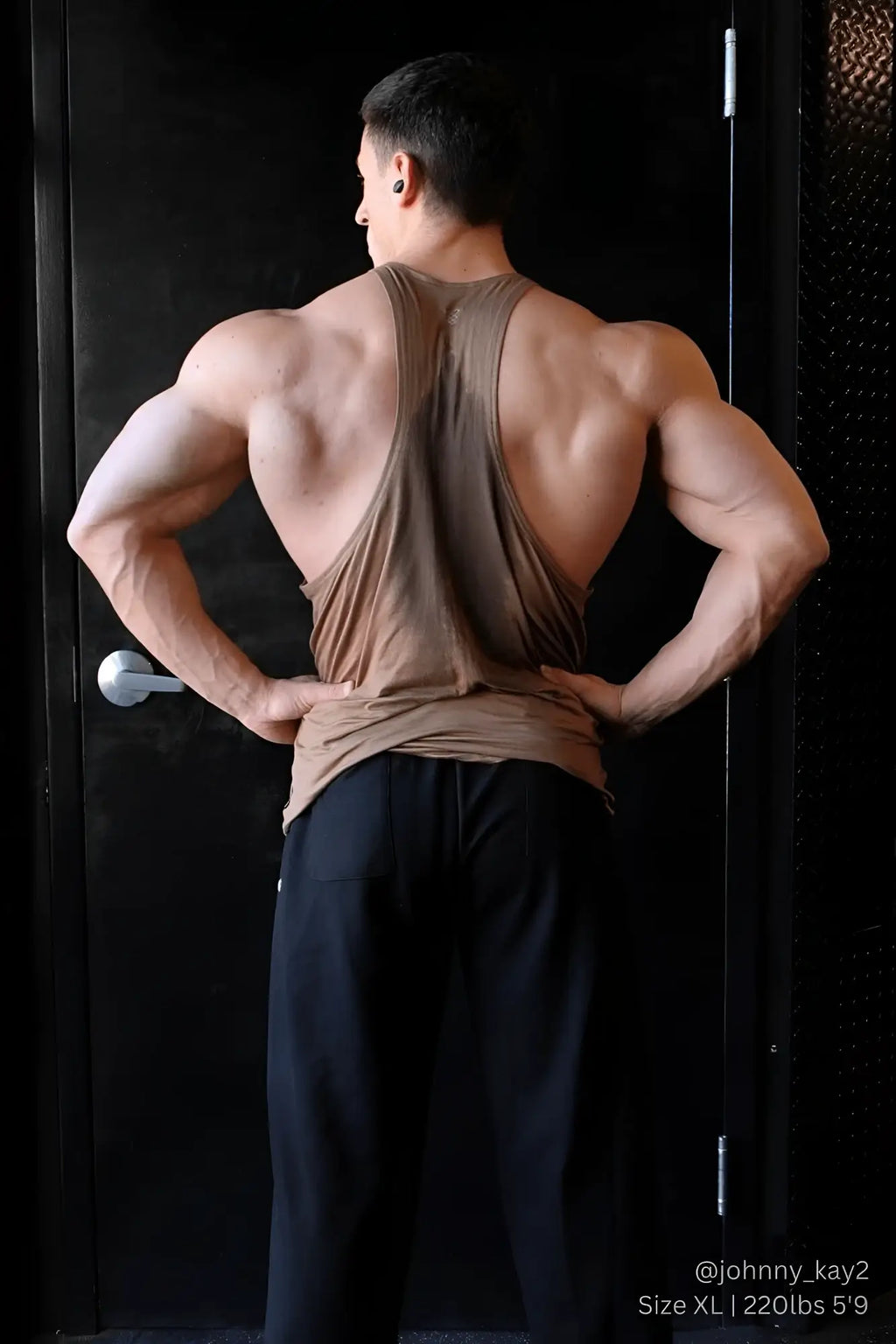 Back view of a jed north classic bodybuilding racerback stringer in walnut brown with a deep cutout and muscle-tight fit