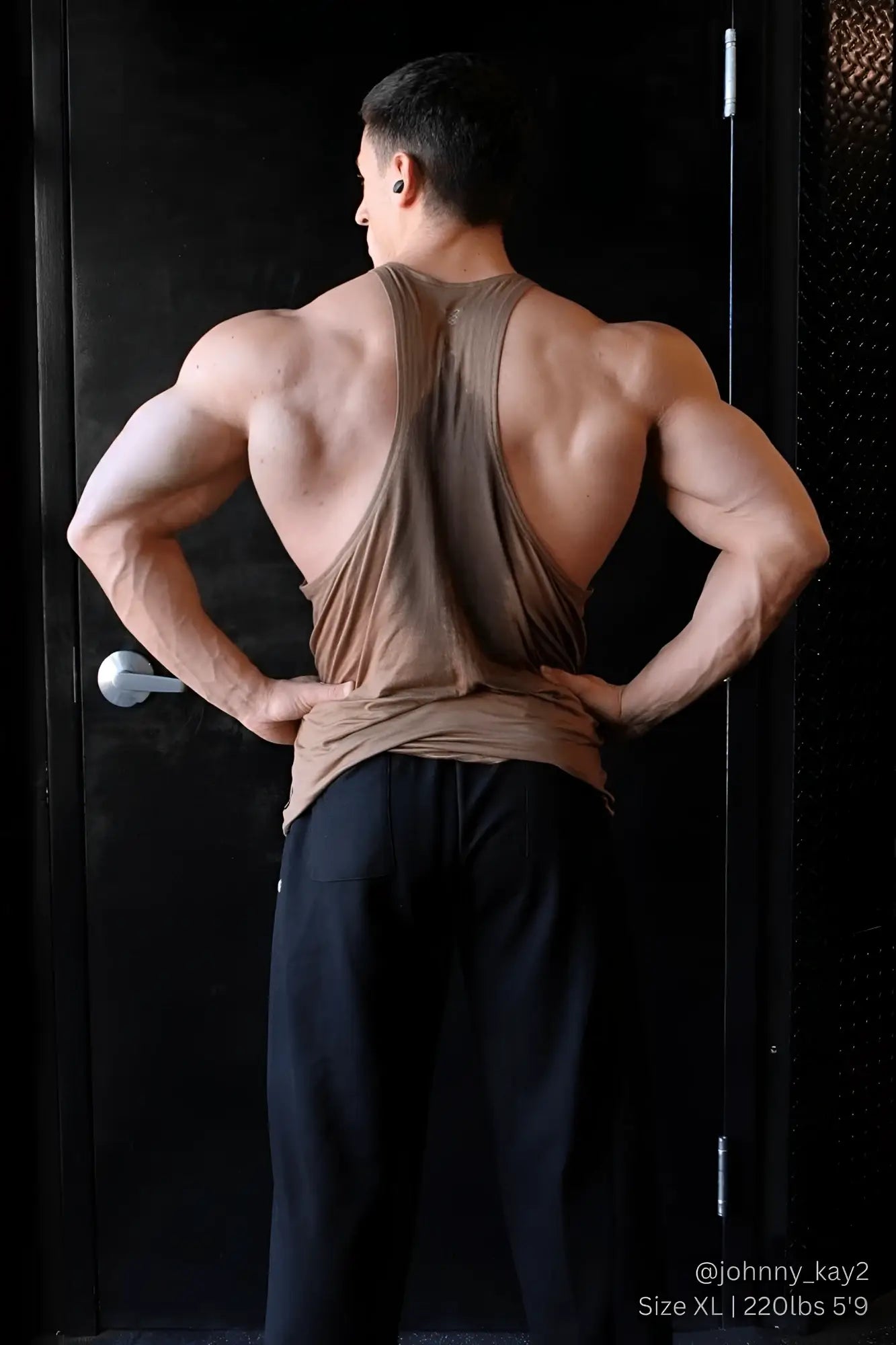 Back view of a jed north classic bodybuilding racerback stringer in walnut brown with a deep cutout and muscle-tight fit