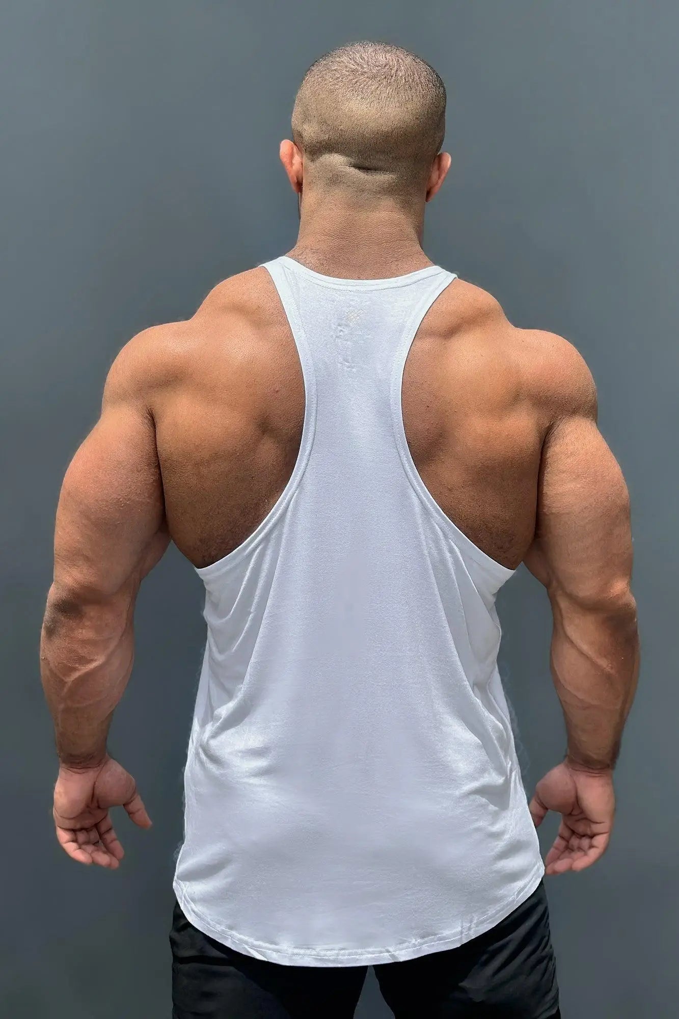 White classic bodybuilding racerback stringer muscle tank top made of breathable fabric for gym workouts