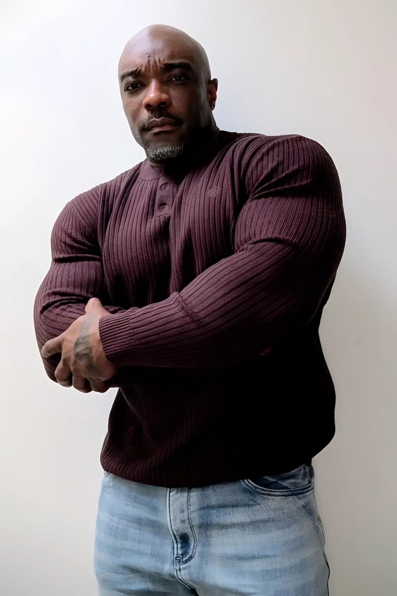 Classic henley sweater brown is a maroon ribbed knit henley shirt with a buttoned placket front