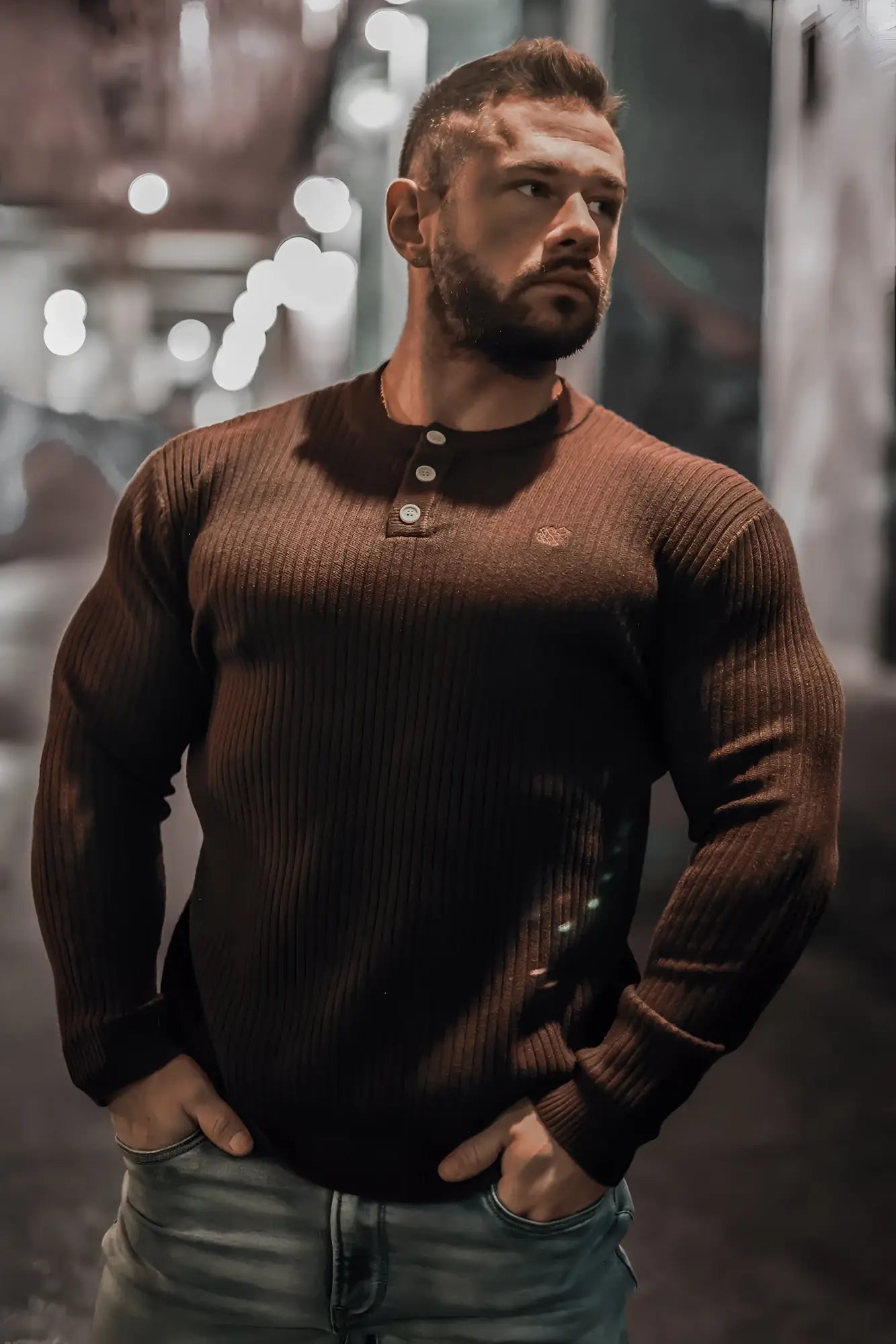 Brown ribbed knit henley sweater with three silver buttons and small embroidered logo on the chest classic henley sweater