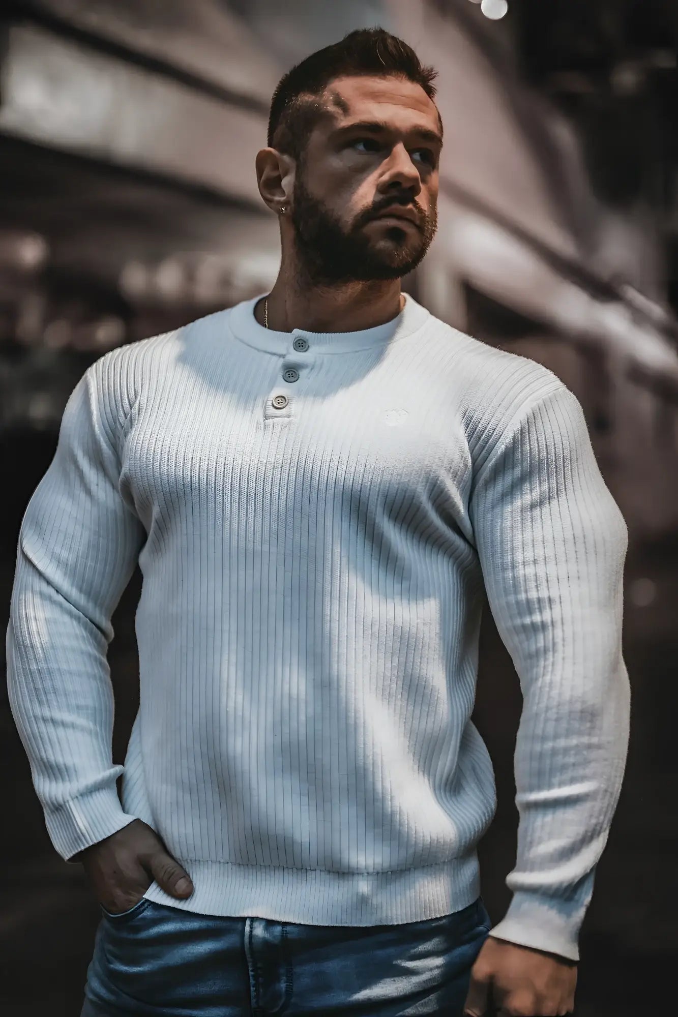 Classic henley sweater in light blue ribbed knit with three silver buttons for versatile layering