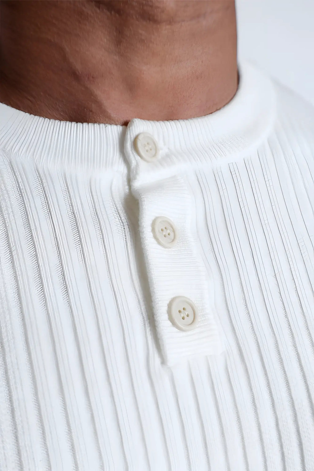 White ribbed knit henley shirt with cream buttons from the classic henley sweater cream collection