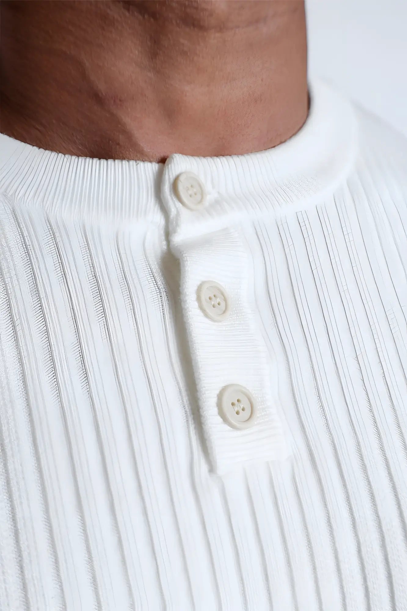 White ribbed knit henley shirt with cream buttons from the classic henley sweater cream collection