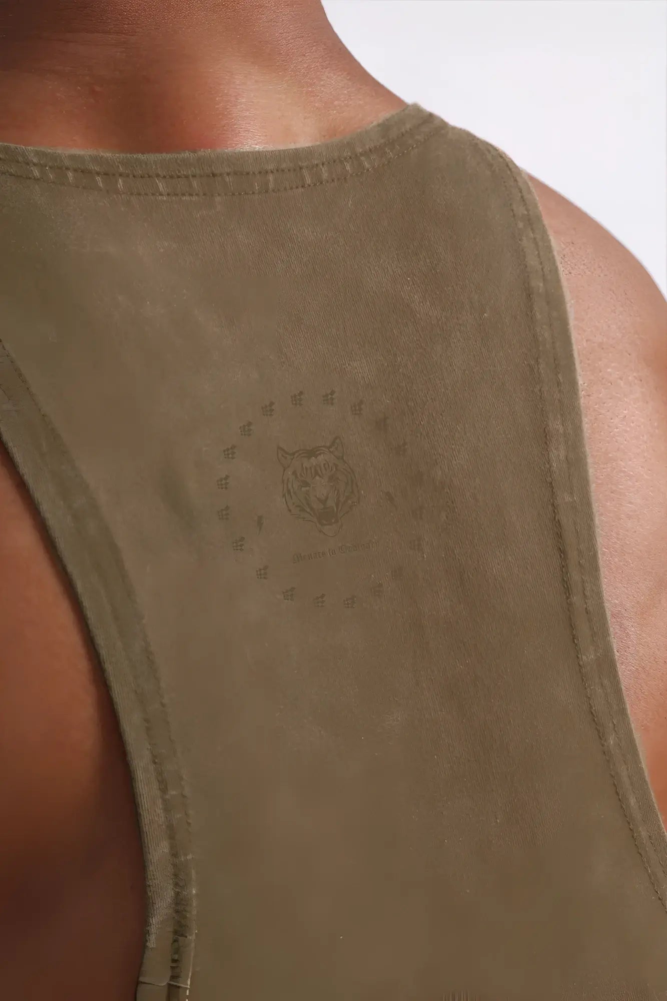 Olive green distressed cotton tank top with subtle tiger head graphic and circular text in classic vintage racerback style