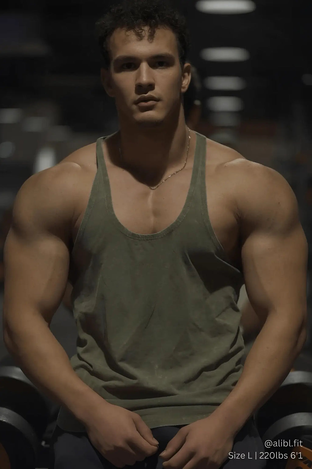 Olive green cotton classic vintage washed racerback stringer tank top showing the back side