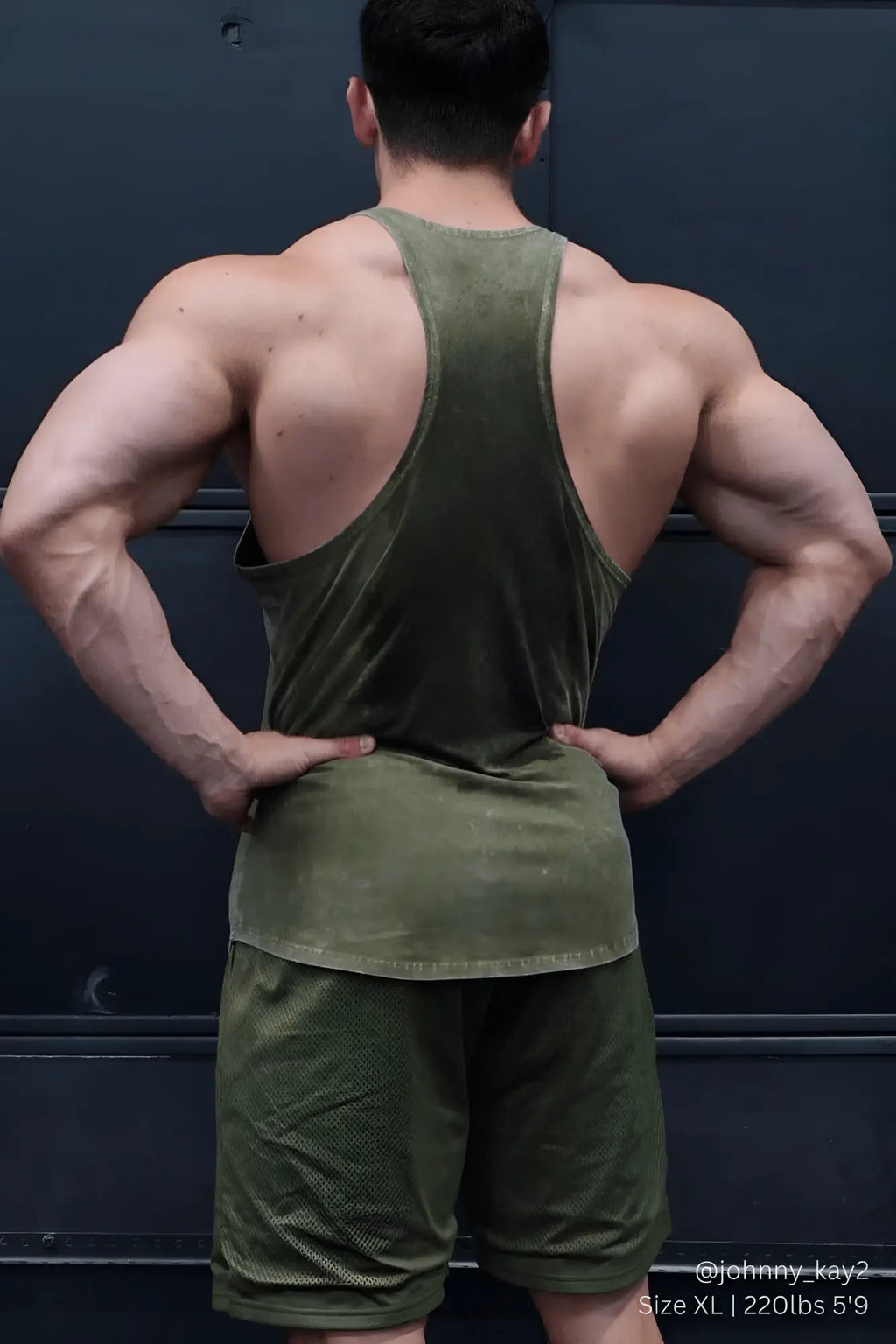 Olive green slightly faded cotton tank top with racerback design classic vintage washed racerback stringer hunter green