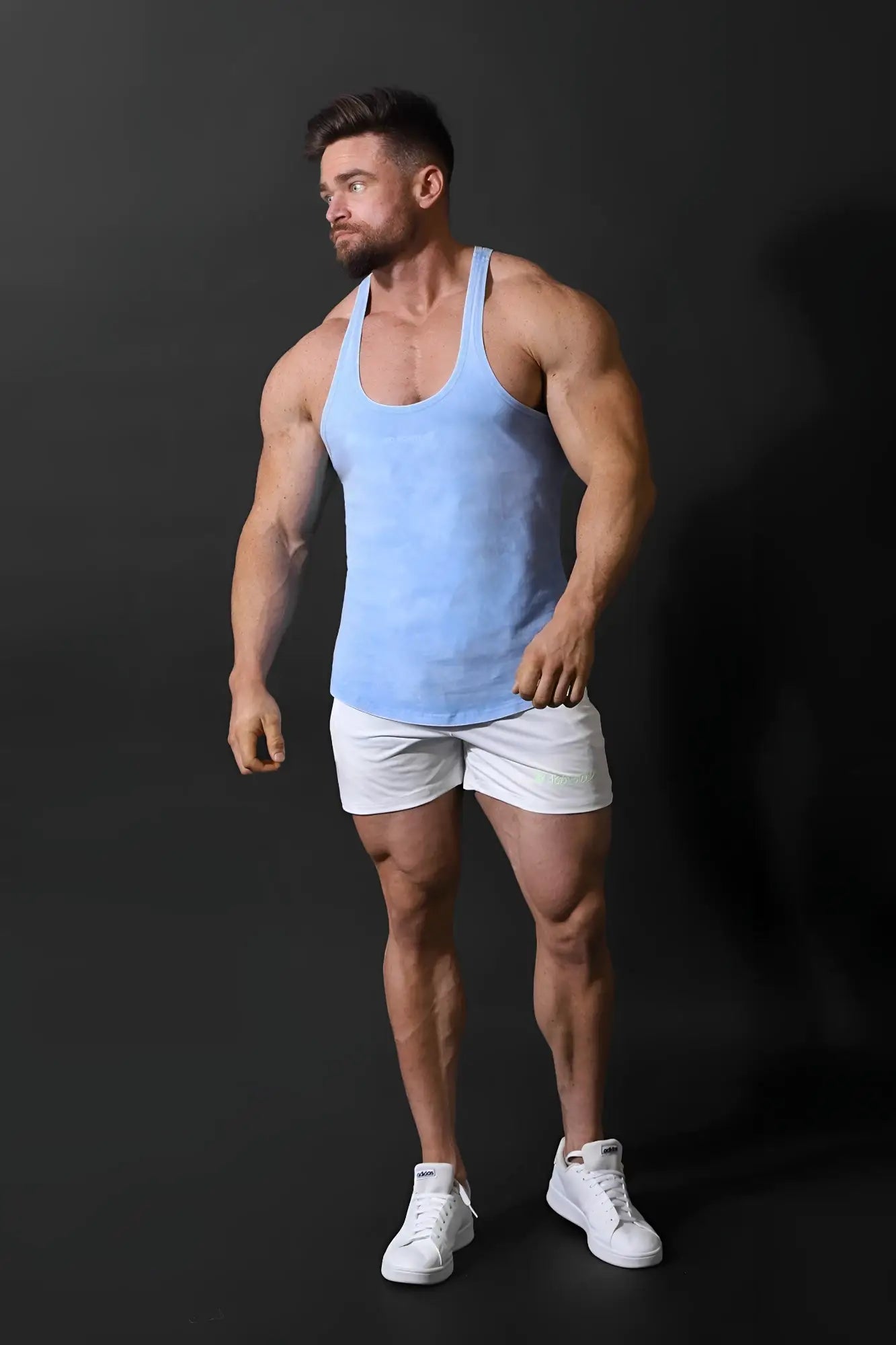 A light blue classic vintage washed racerback stringer tank top with soft fabric texture and sleeveless design