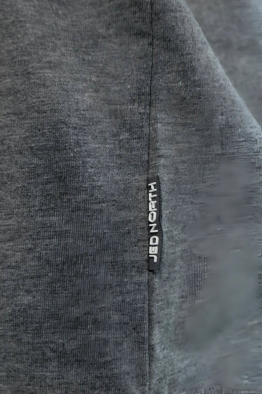Cotton training stringer in heather gray with gray fabric and a black vertical tag labeled strongb in white lettering