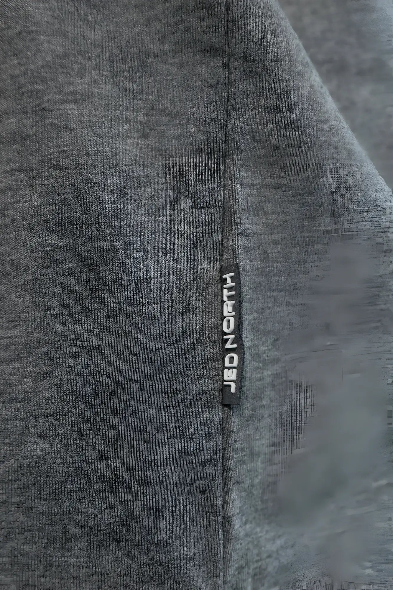 Cotton training stringer in heather gray with gray fabric and a black vertical tag labeled strongb in white lettering
