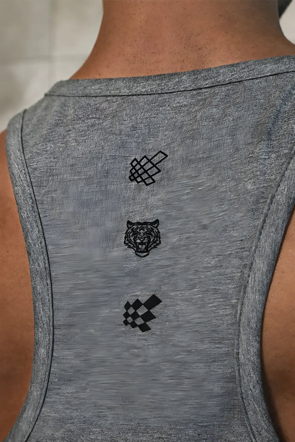 Back view of cotton training stringer heather gray muscle tank with three black embroidered designs on the back