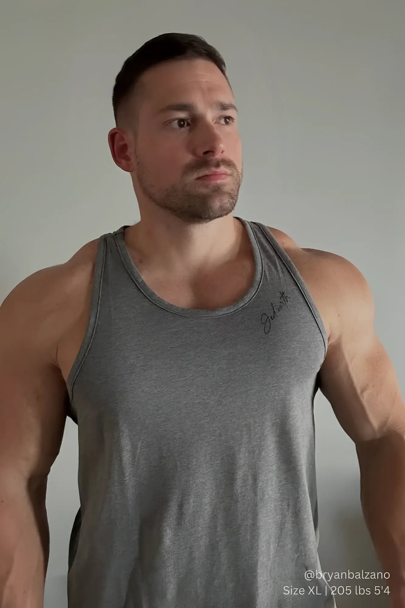 Gray heathered cotton training stringer tank top with subtle signature embroidery on the left side