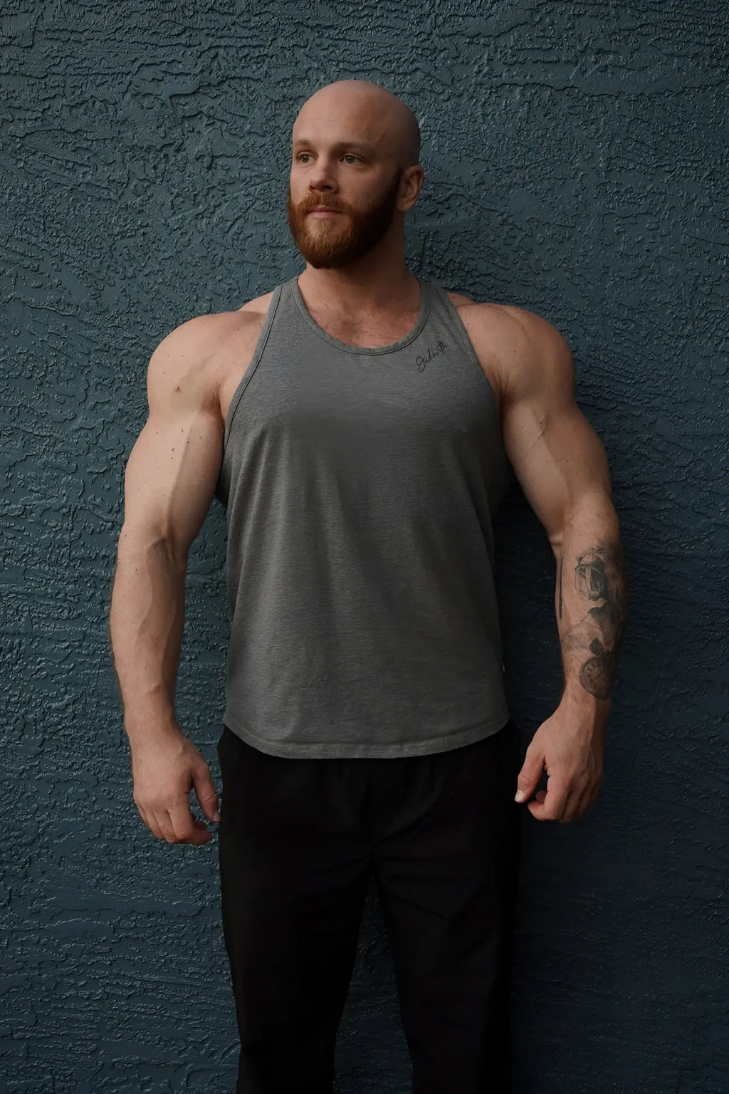 Gray cotton training stringer muscle tank top with a subtle logo on the left chest in heather gray color