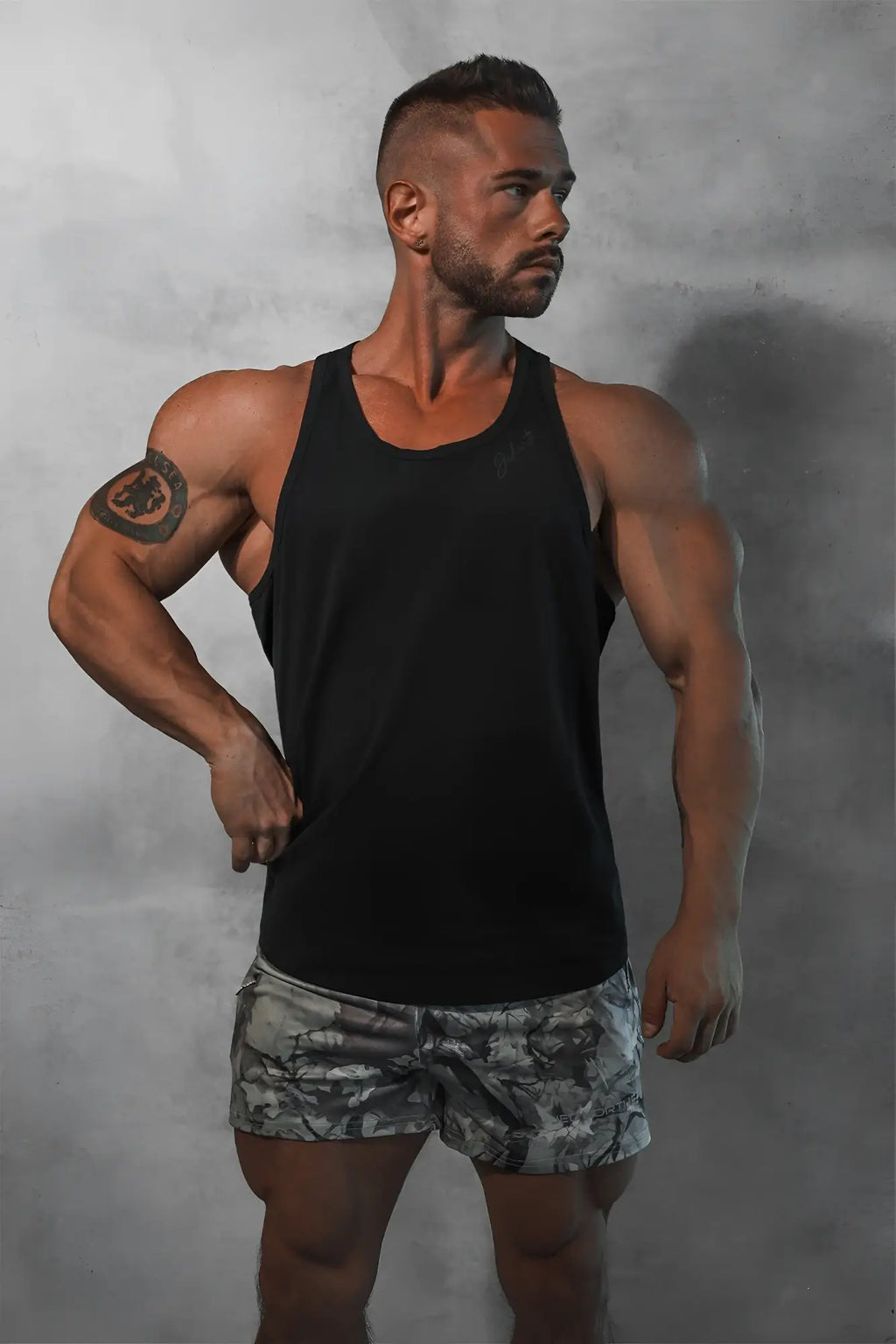Black sleeveless cotton training stringer tank top with simple fitted design in midnight color for workouts