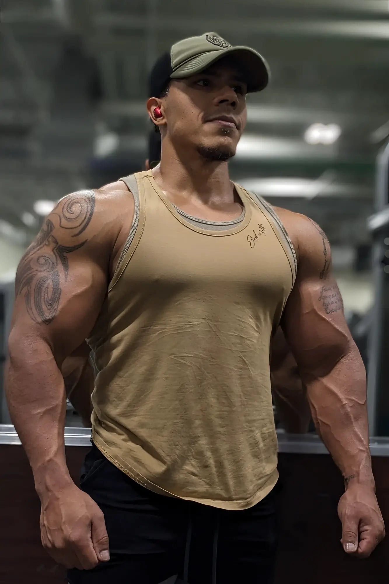 A tan cotton training stringer tank top with ribbed neckline and subtle gray trim for athletic use