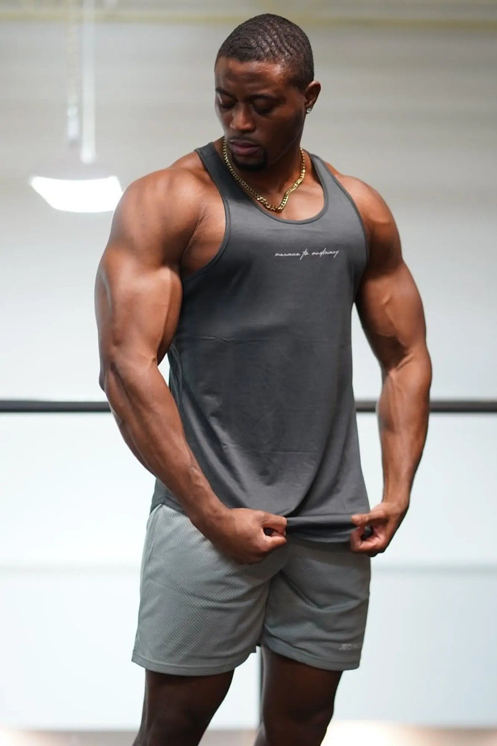 Gray jed north dynamic bodybuilding stringer tank top with subtle embroidered logo across the chest