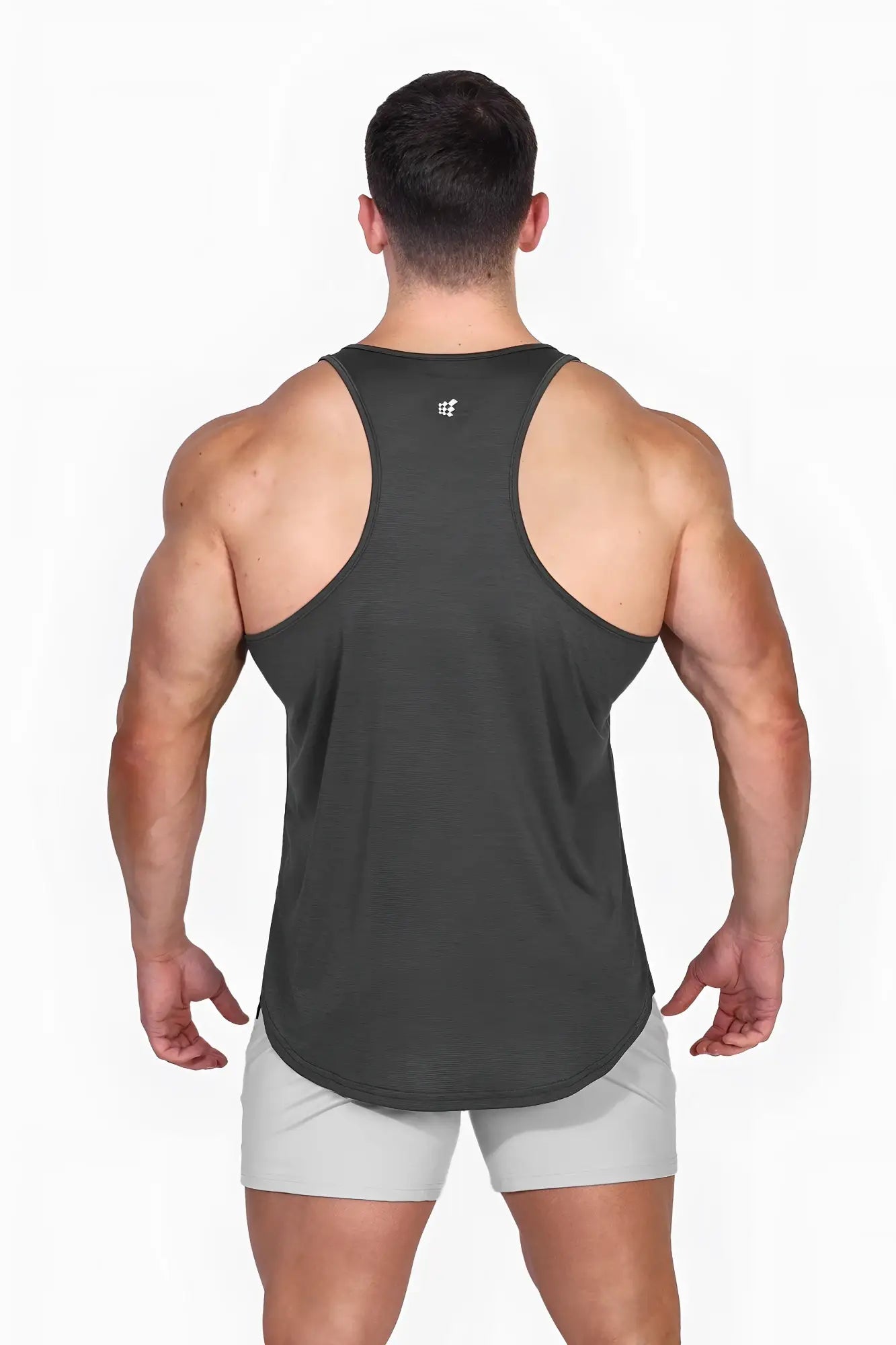 Dark gray jed north dynamic bodybuilding stringer muscle tank top with subtle logo at the neckline