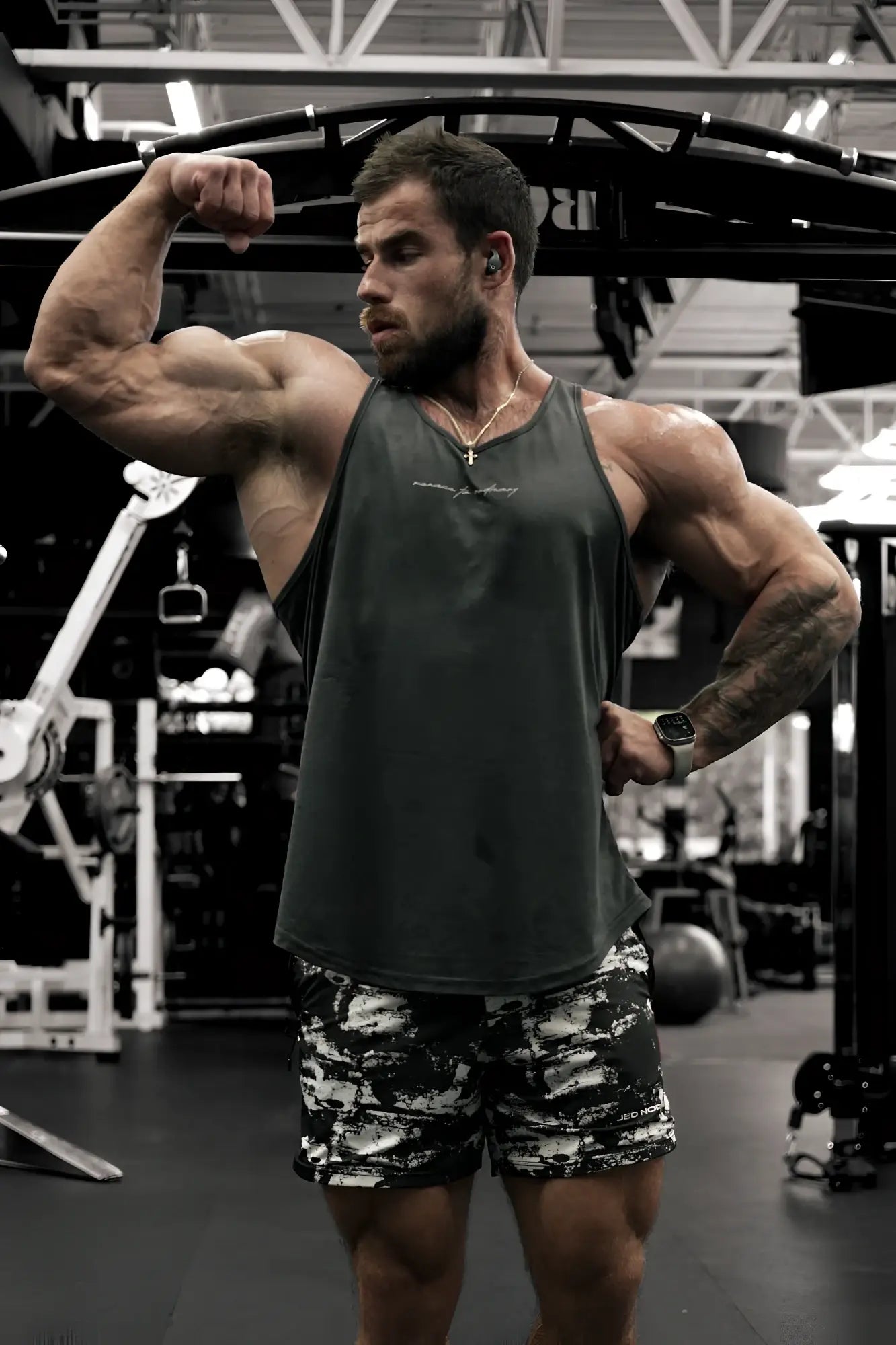 Jed North dynamic bodybuilding stringer in dark gray featuring a sleeveless design and small embroidered chest logo