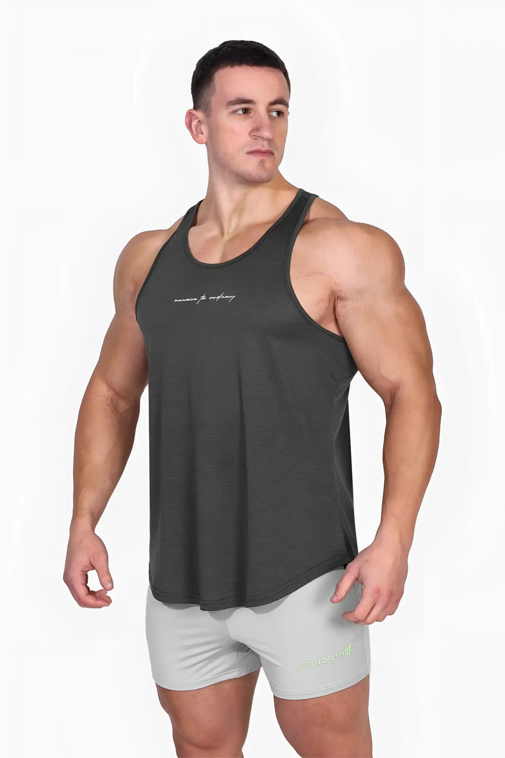 Dark gray sleeveless tank top with subtle embroidered logo across chest jed north dynamic bodybuilding stringer