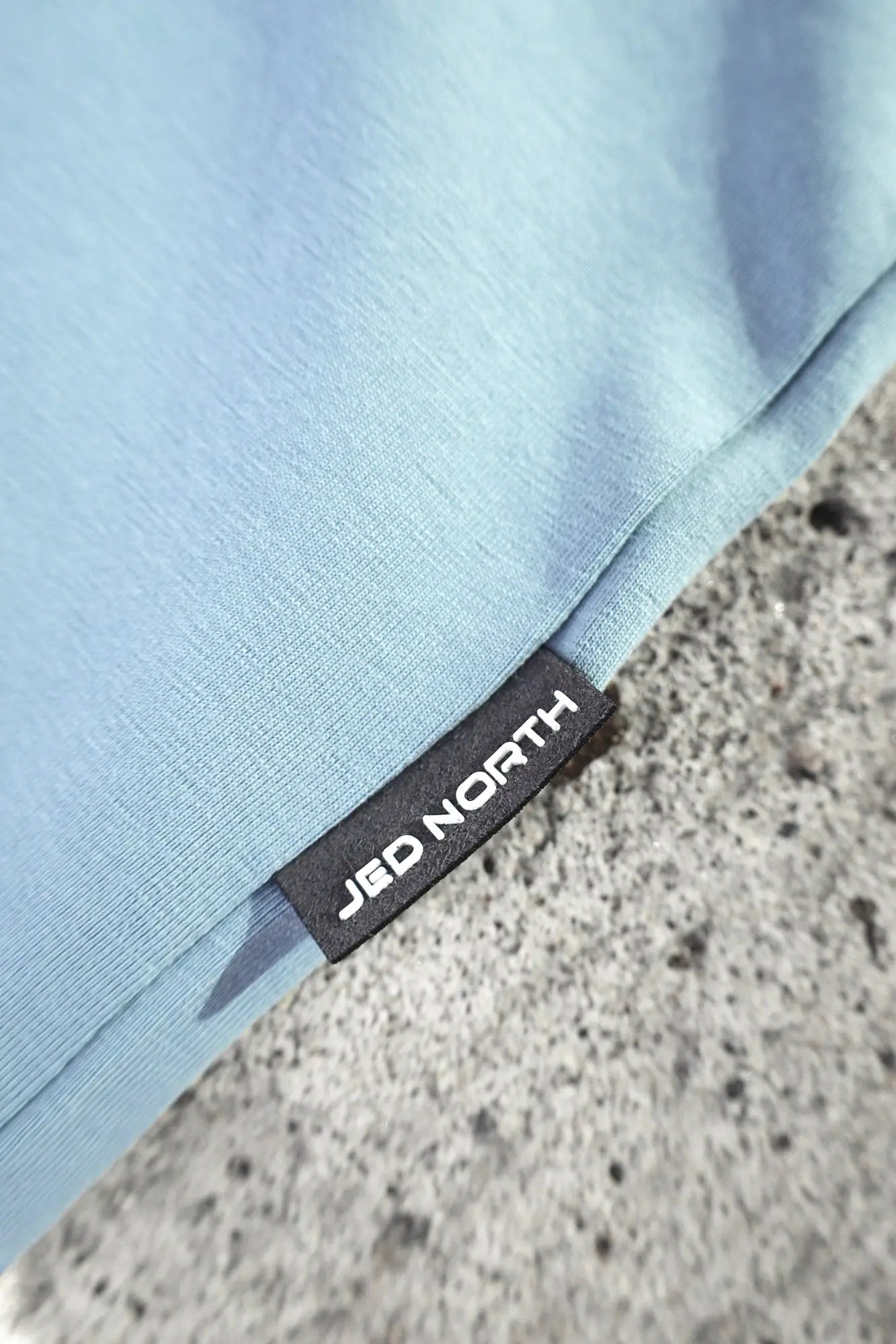 Light blue jed north energy oversized long sleeve t shirt 2.0 with black brand tag stitched into seam