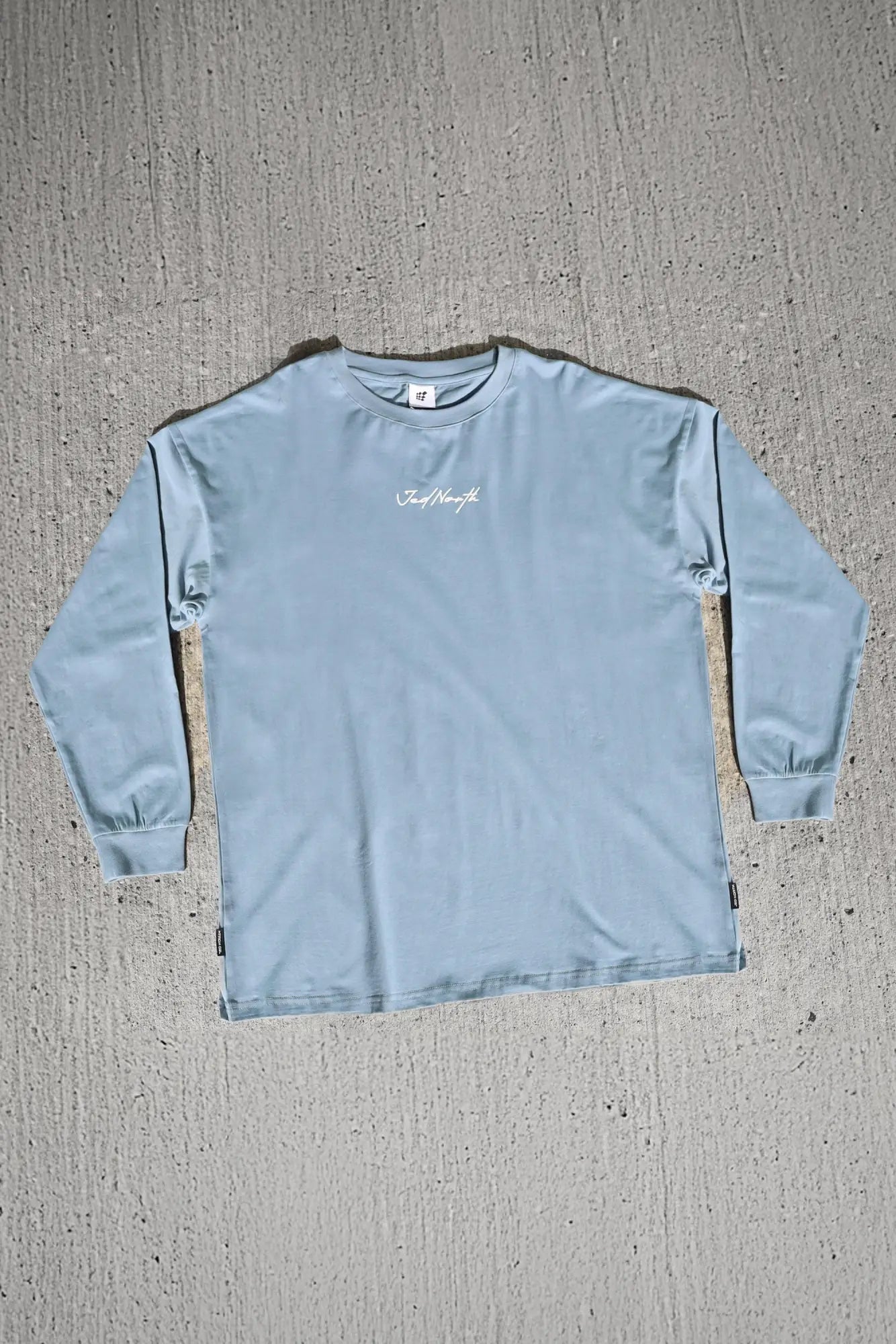 Jed North Energy oversized long sleeve t-shirt 2.0 in arctic blue with a subtle white cursive logo on the chest