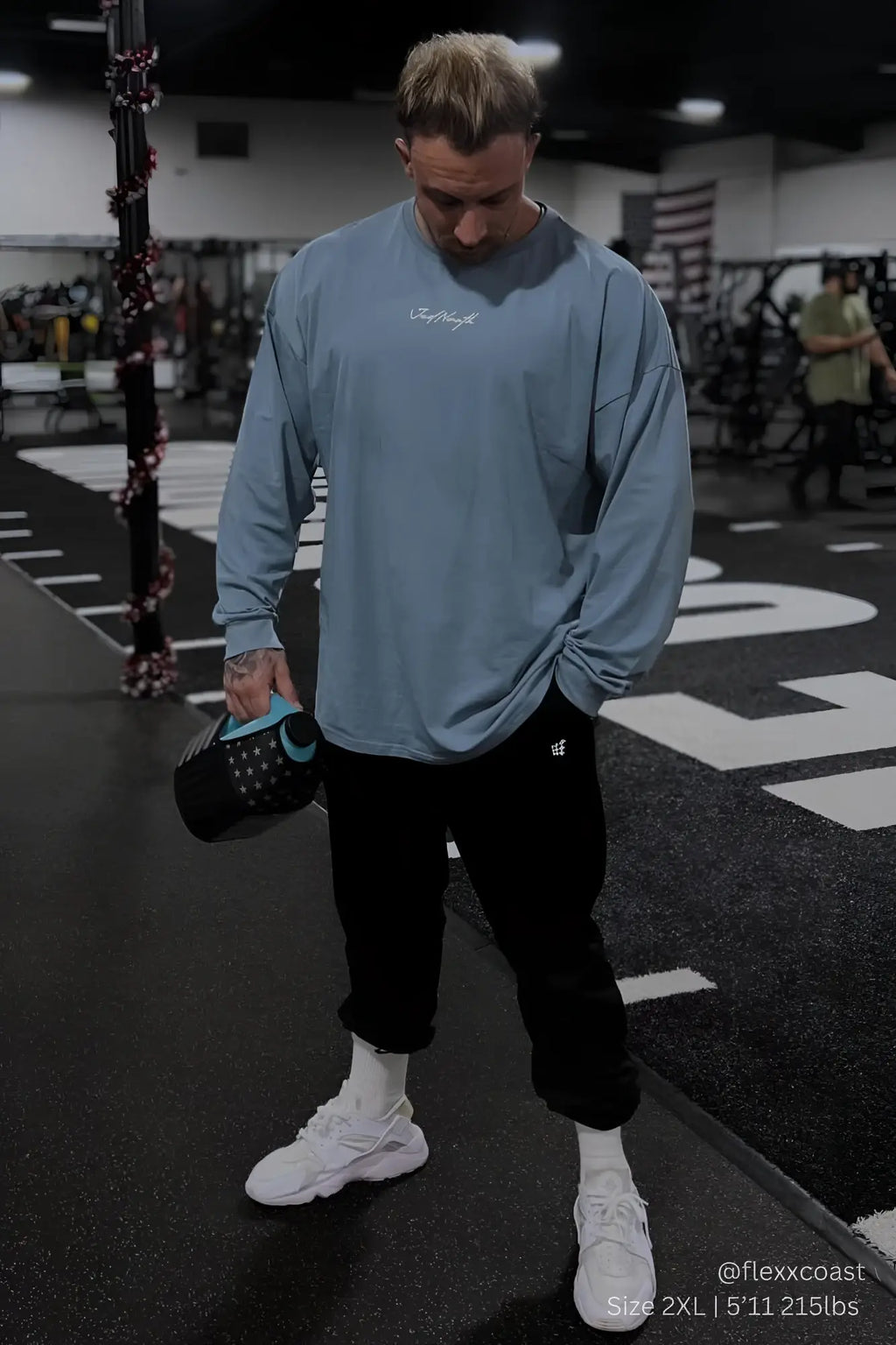 Light blue arctic blue jed north energy oversized long sleeve t-shirt with white cursive logo on chest