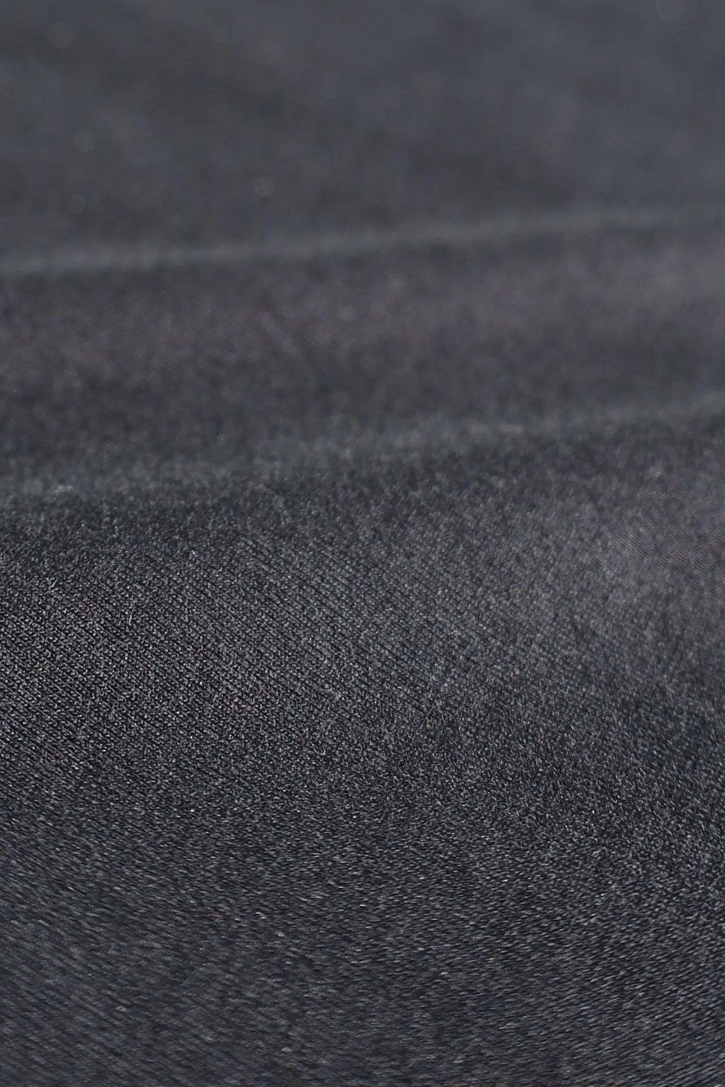 Jed north energy oversized long sleeve t-shirt 2.0 obsidian black made of dark gray denim fabric with a textured worn surface