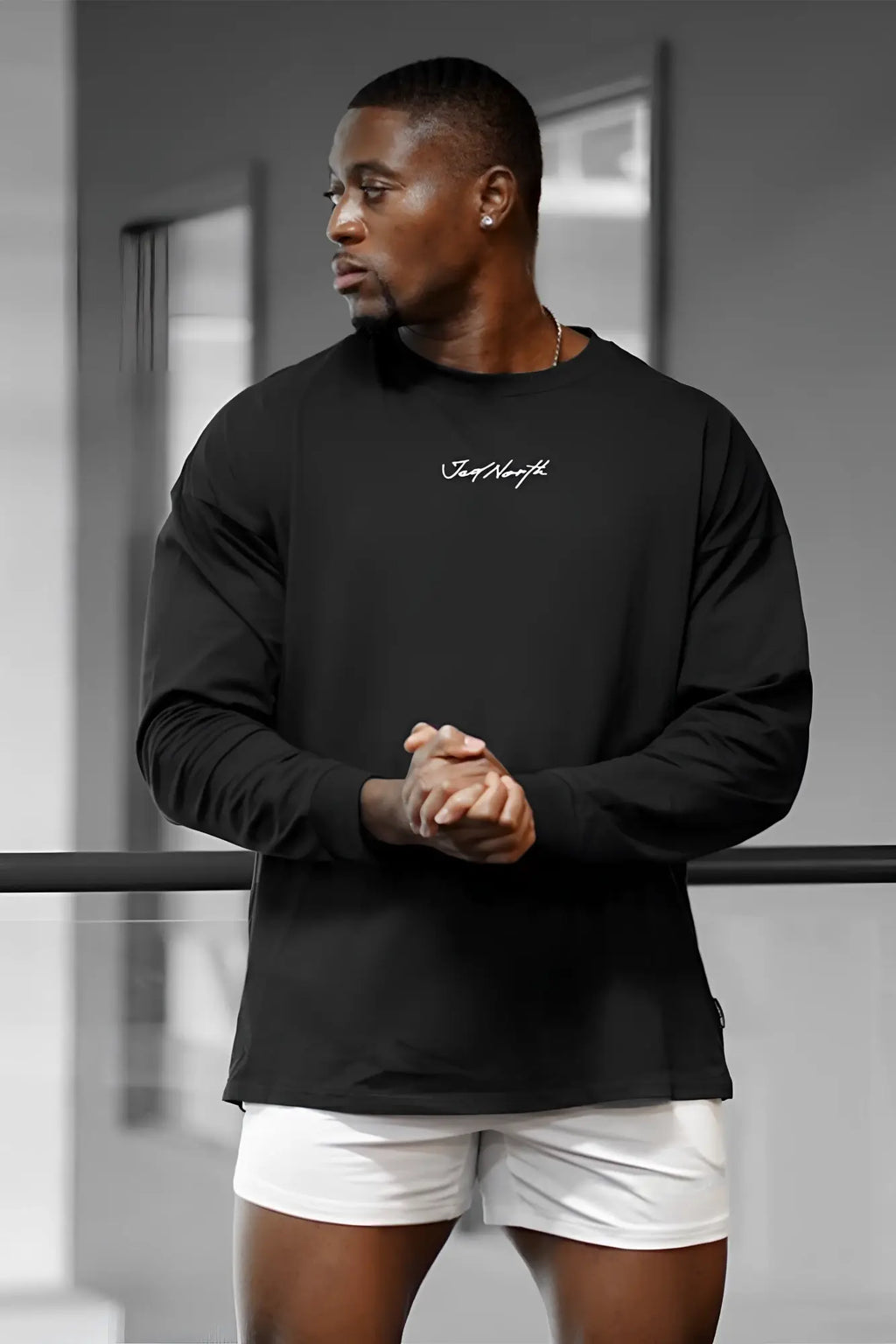 Black jed north energy oversized long sleeve t shirt 2.0 with white cursive logo on front chest in crewneck style