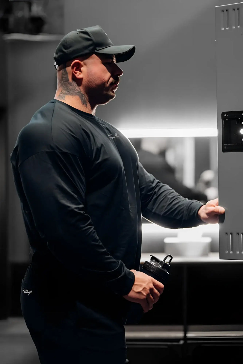 Black long-sleeved jed north energy oversized t-shirt 2.0 with subtle white logo on chest and sleeve in obsidian black