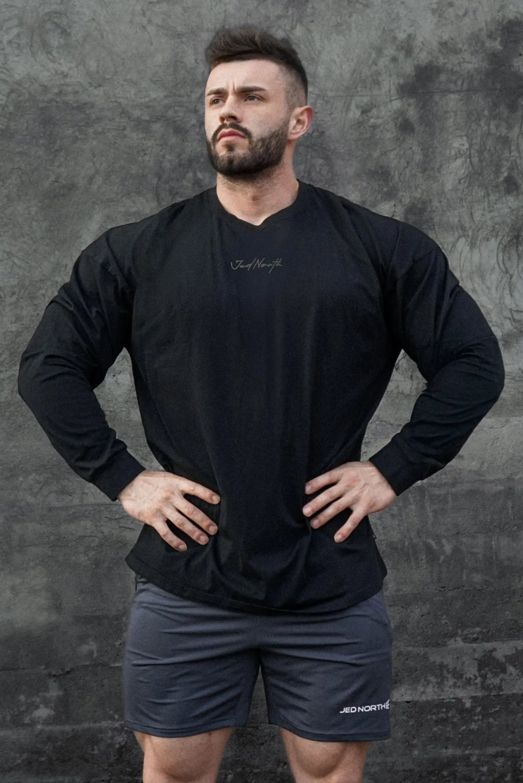 Jed North Energy oversized long sleeve v neck athletic shirt in obsidian black with subtle white cursive logo on chest