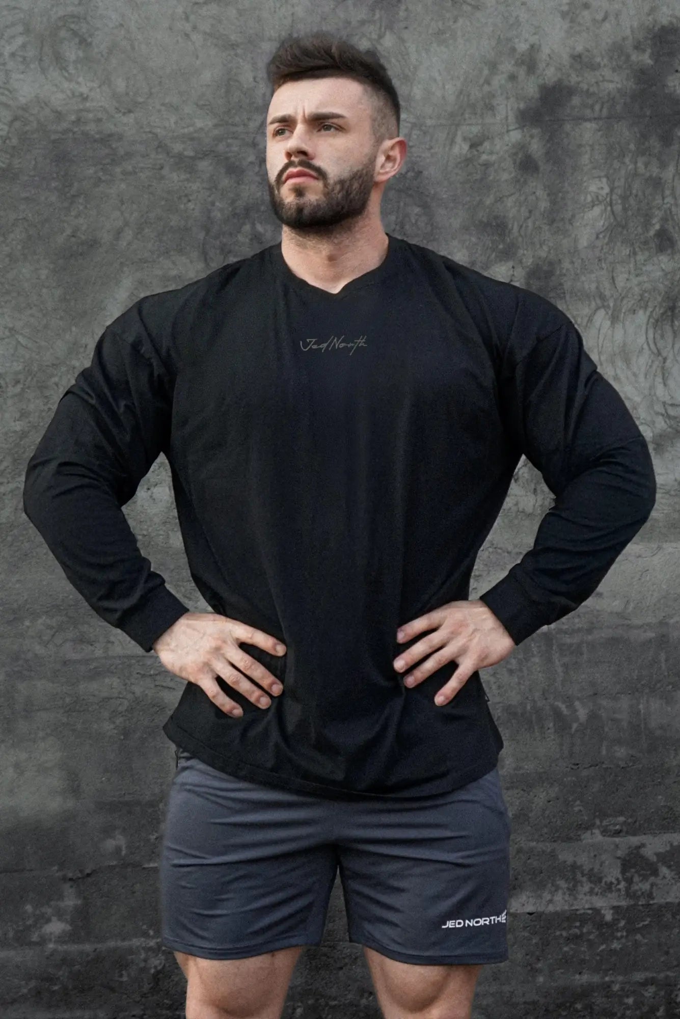 Jed North Energy oversized long sleeve v neck athletic shirt in obsidian black with subtle white cursive logo on chest