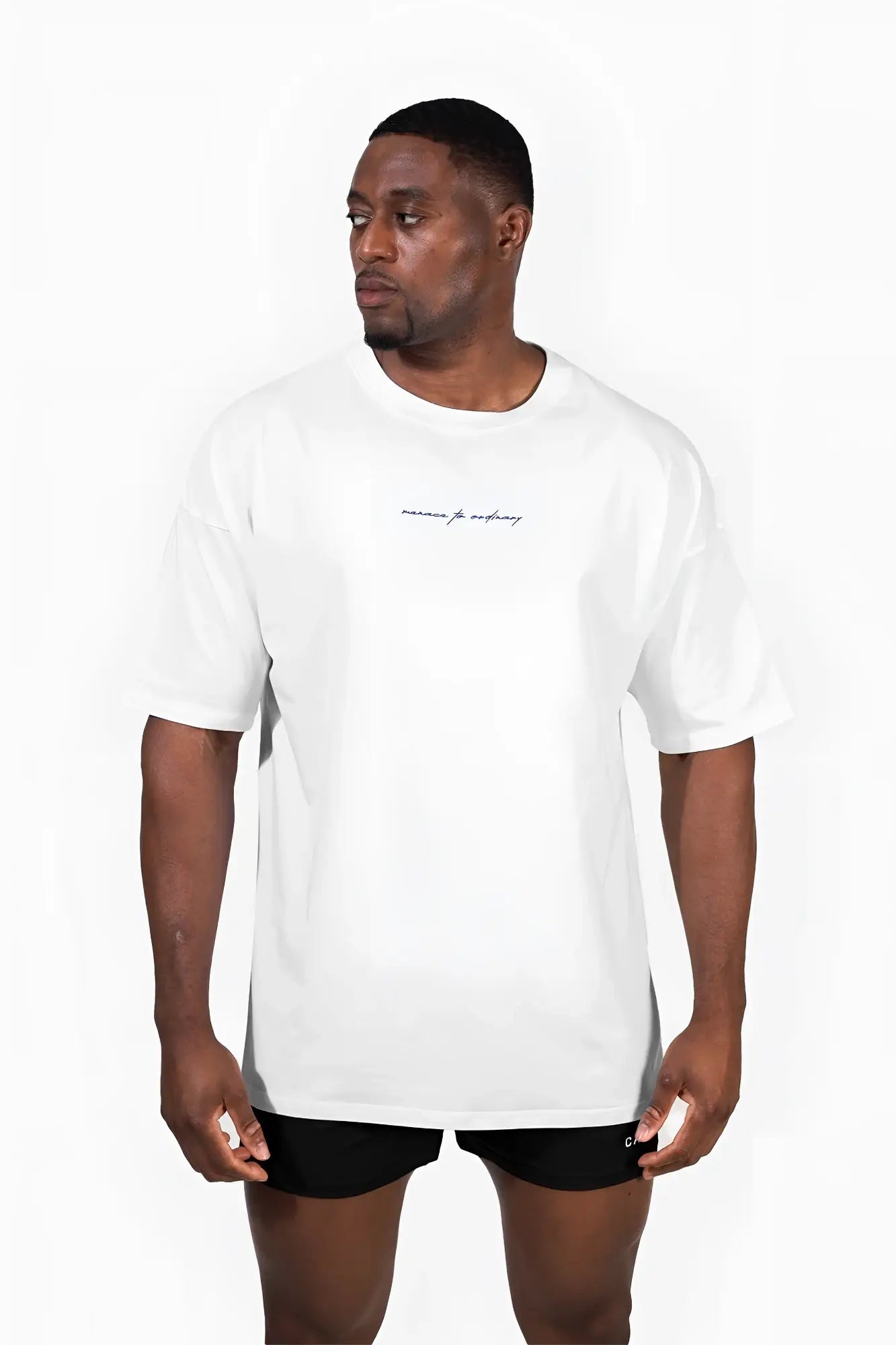 Cream oversized energy t-shirt with subtle black cursive embroidery on chest in soft cotton material