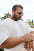 Energy oversized cream t-shirt with a subtle black cursive logo on the chest in breathable cotton fabric