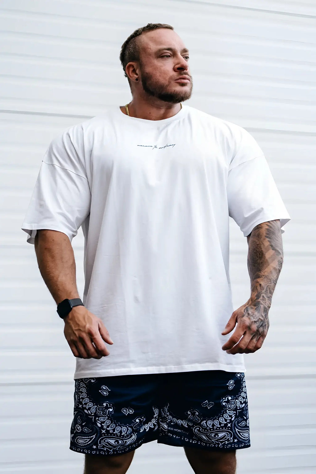 Energy oversized t-shirt cream featuring a white oversized fit with subtle black script logo across the chest