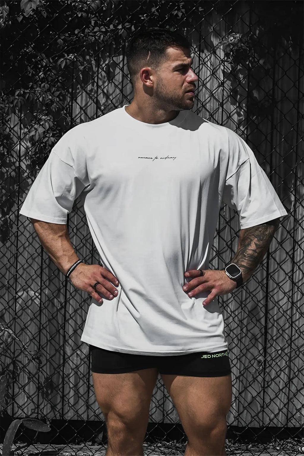 Energy oversized t shirt cream featuring a white oversized fit with a subtle cursive chest logo in soft cotton material
