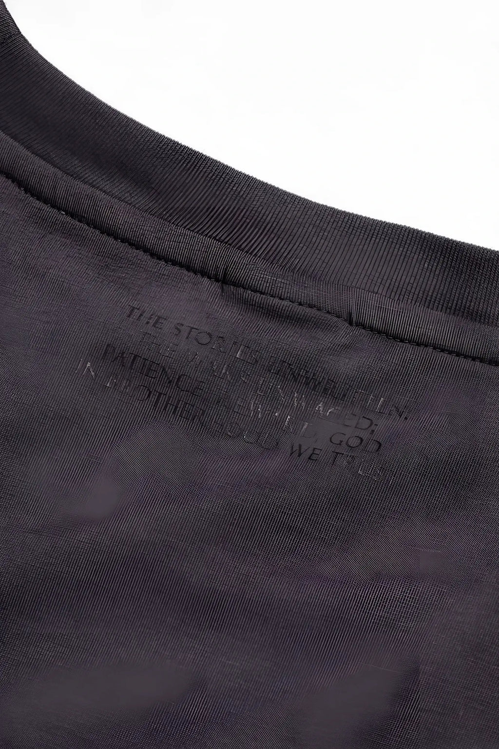 Dark gray cotton jed north energy oversized t-shirt with subtle embossed text label at the neckline
