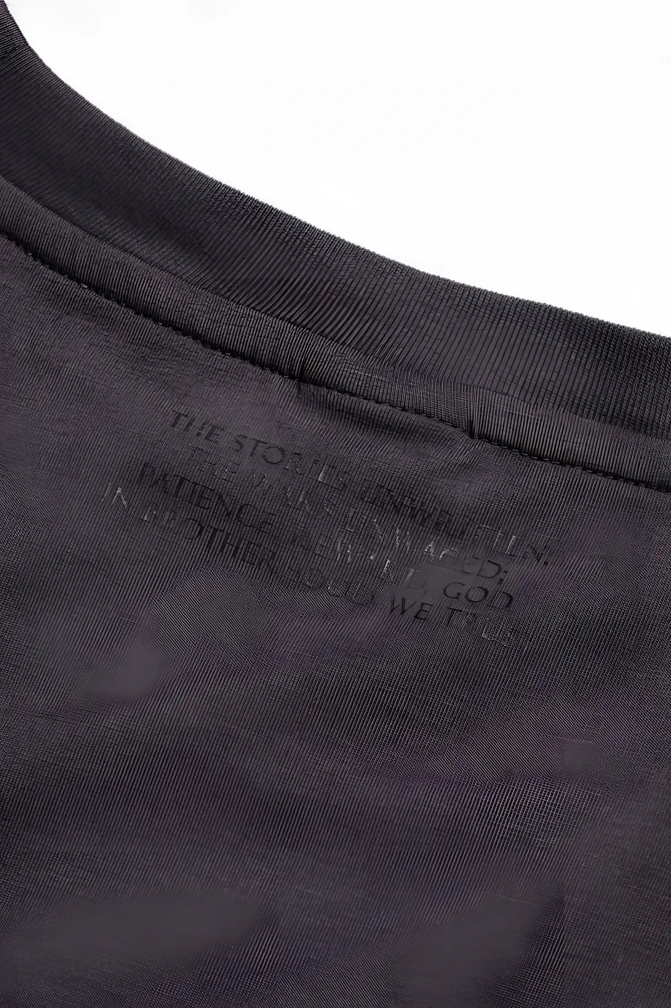 Dark gray cotton jed north energy oversized t-shirt with subtle embossed text label at the neckline
