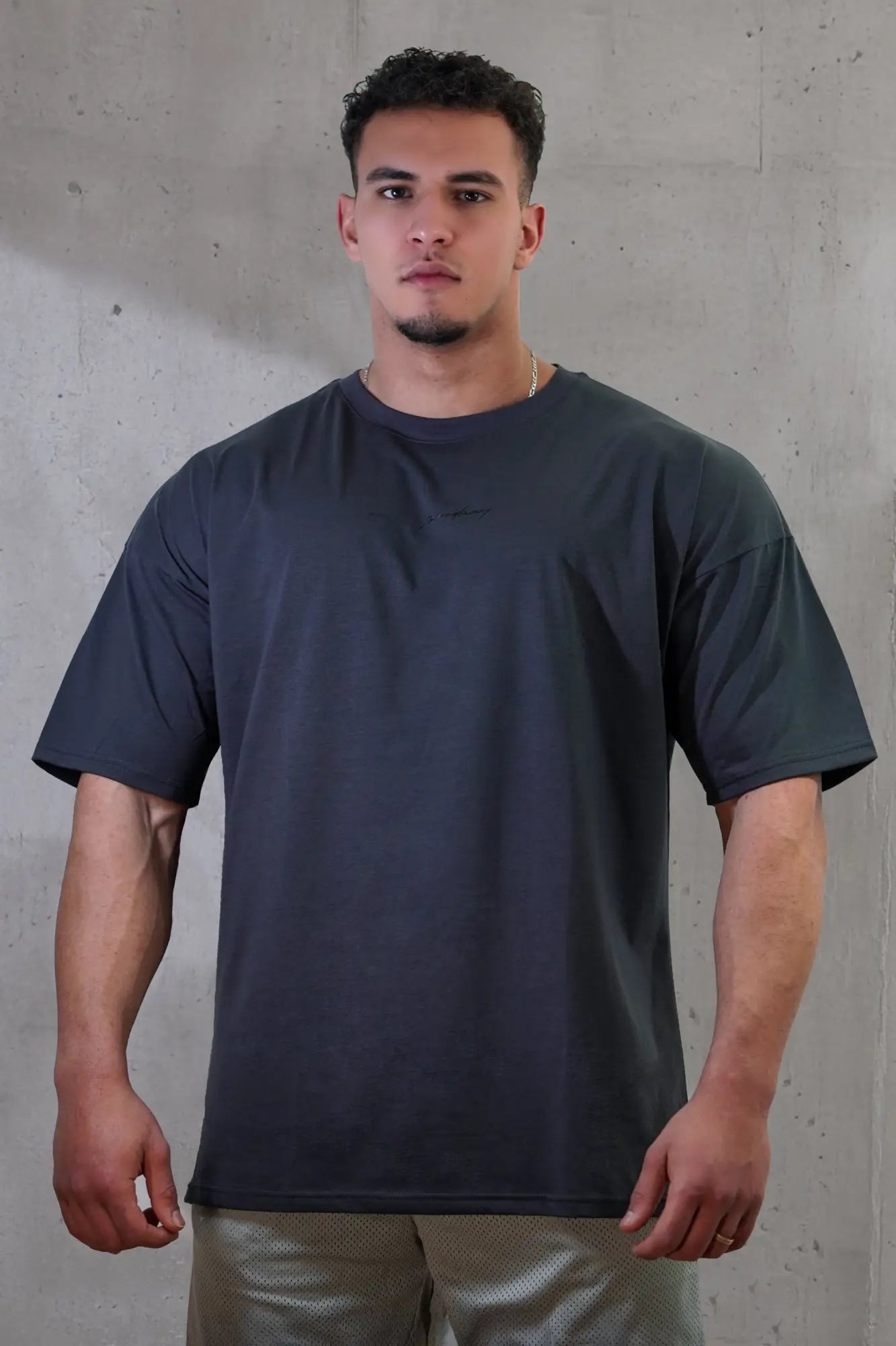 Dark gray jed north energy oversized crewneck t-shirt with subtle logo on left chest perfect for casual wear