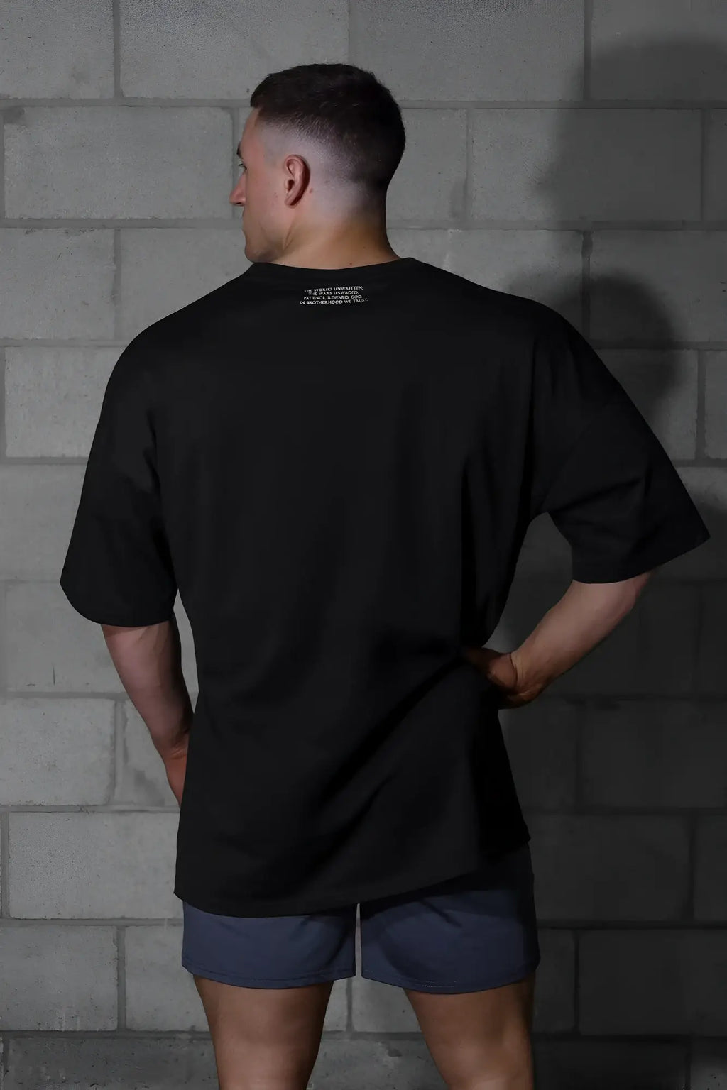 Jed north energy oversized t-shirt in menace black with short sleeves crew neck and subtle white text near collar