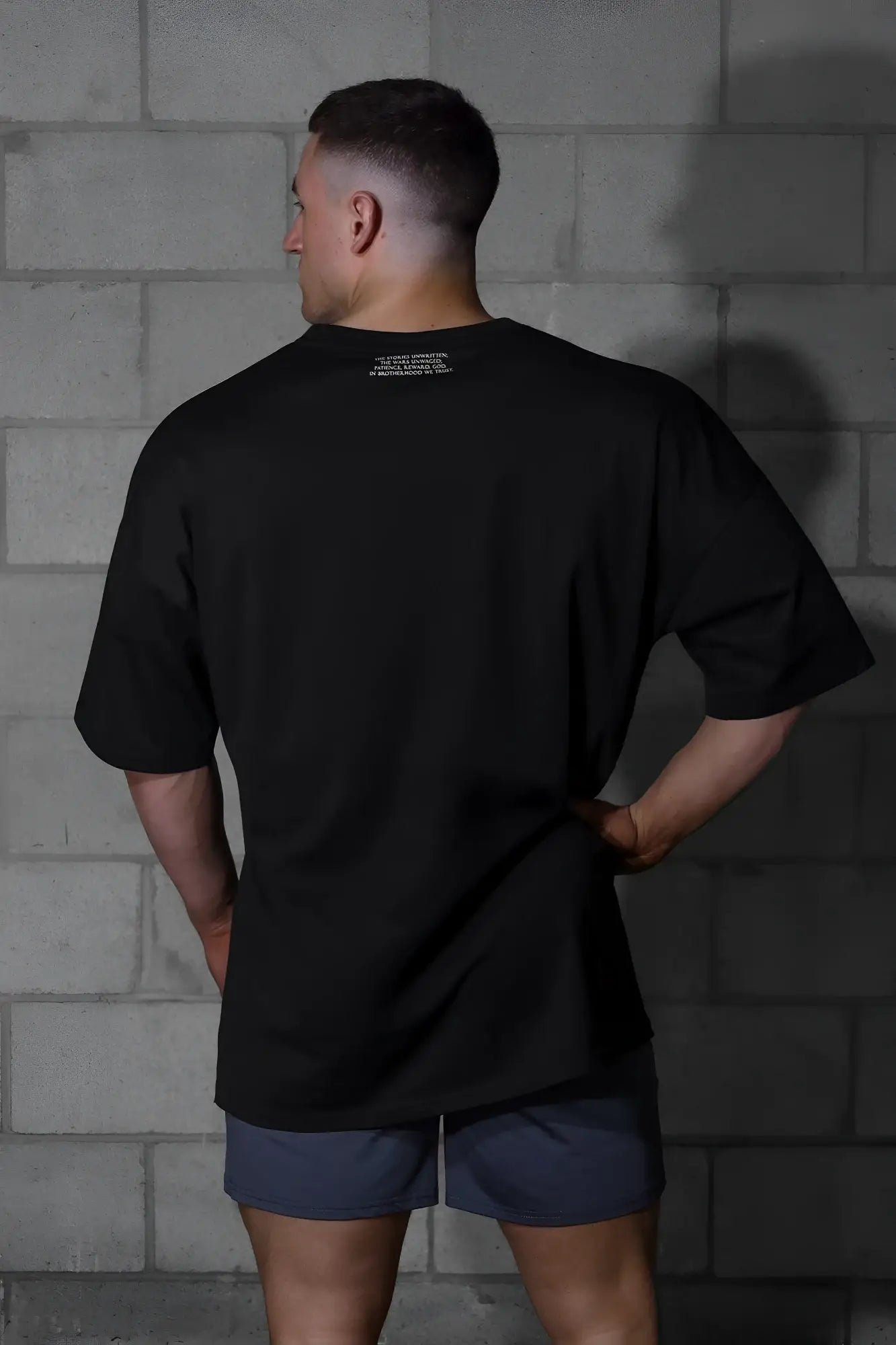 Jed north energy oversized t-shirt in menace black with short sleeves crew neck and subtle white text near collar