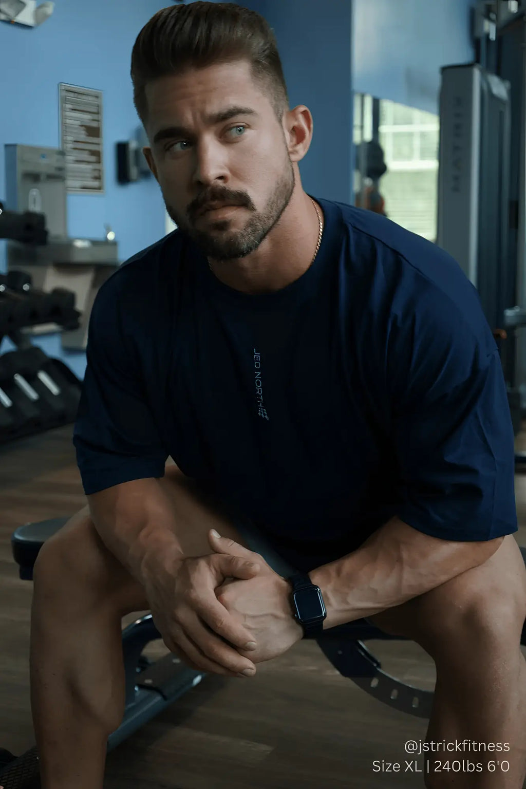 Jed North energy oversized t-shirt in midnight blue with vertical white text on the left chest area