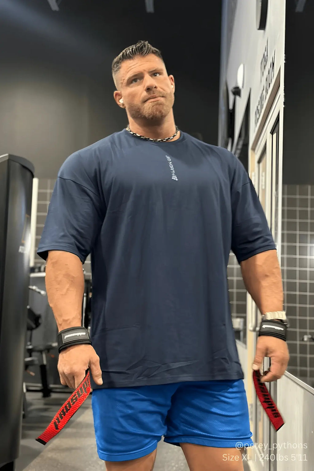 Navy blue Jed North Energy oversized t-shirt with white vertical text and small logo near the collar in cotton blend